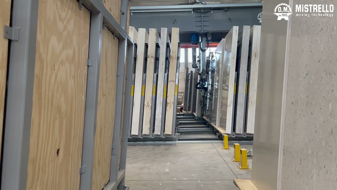 Predator 6-axis system at a slab manufacturer. Portrait slab storage, scanner integration and automatic feeding of cutting lines.
